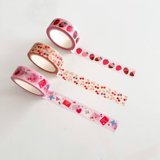 3 washi tapes pulled out to showcase the design -- red and pink envelopes, heart shaped cherries and chocolate covered strawberries