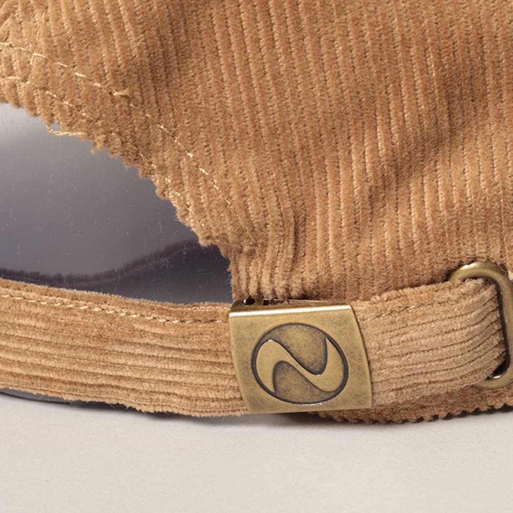 zoomed in view of back adjustable clasp on corduroy coffee hat