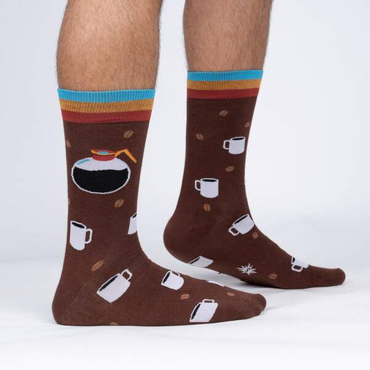 Brown socks with coffee-themed design worn by a person on a white background