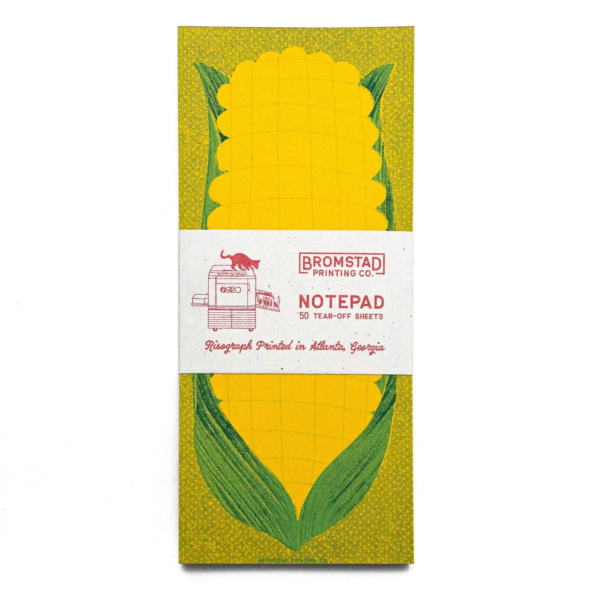 green and yellow notepad, designed with a risograph print of an ear of corn with husk on it