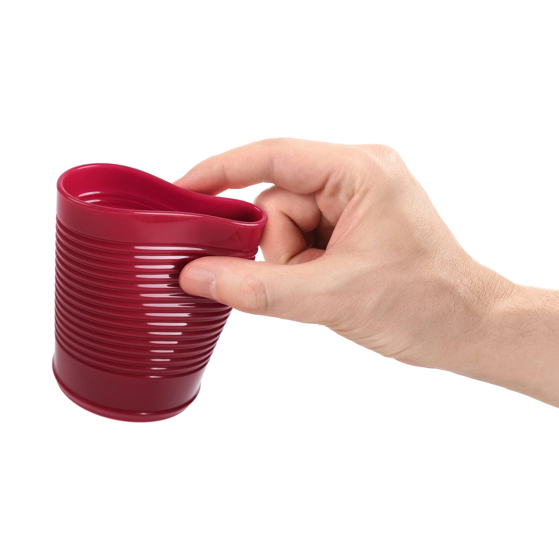 Hand holding the red cranberry silicone cup against a white background