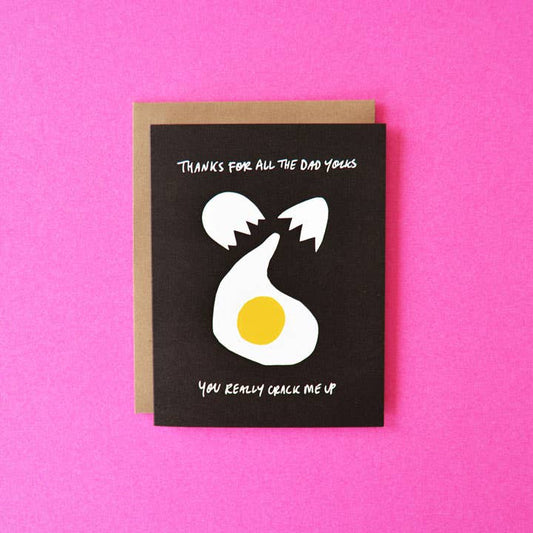 Father's day greeting card with an egg being cracked on it with text that reads "Thanks for all your dad yolks. You really crack me up"