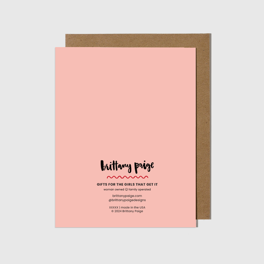 Pink card with brown envelope on a white background