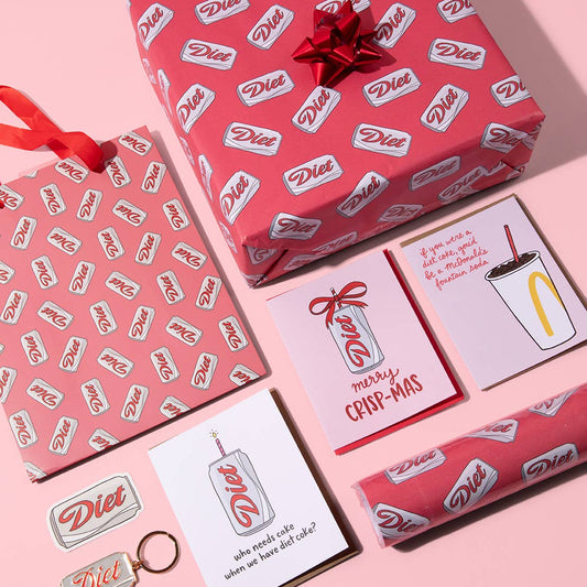 A selection of gift options all with Diet Coke branding on a pink background