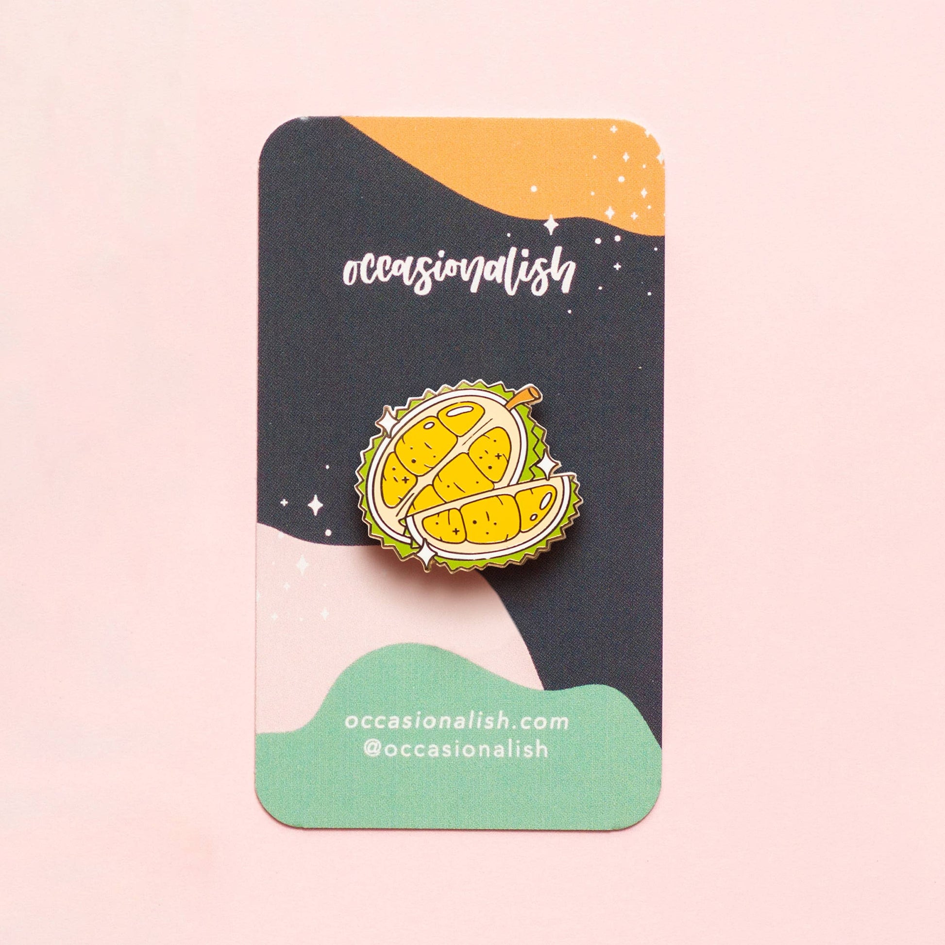 enamel pin of a durian fruit on card backing