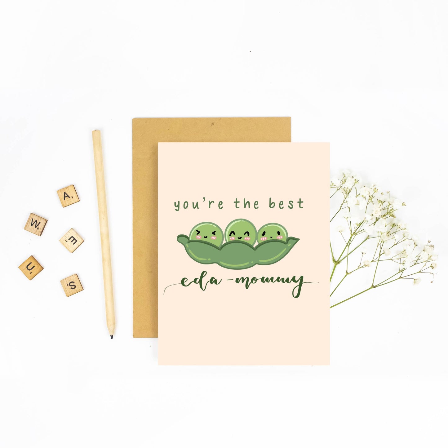 Greeting card with three peas in a pod illustration and text 'you're the best eda-mommy' on a white background.