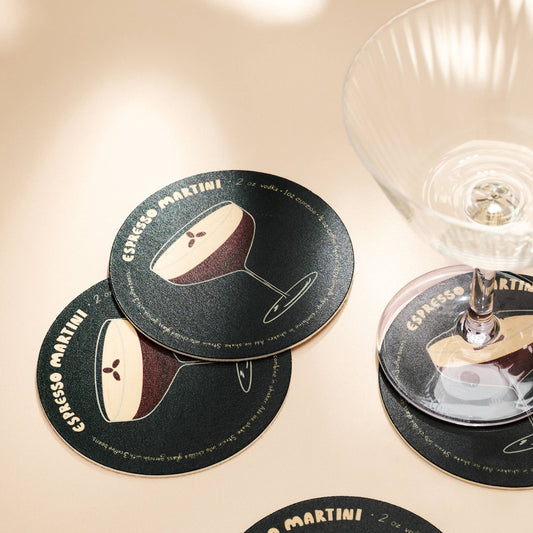 Coasters with Espresso Martini design on a beige surface