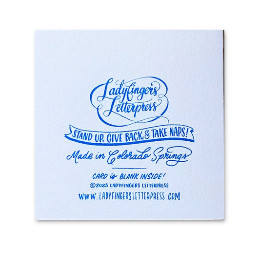back of espresso tiny card with branding and copyright information