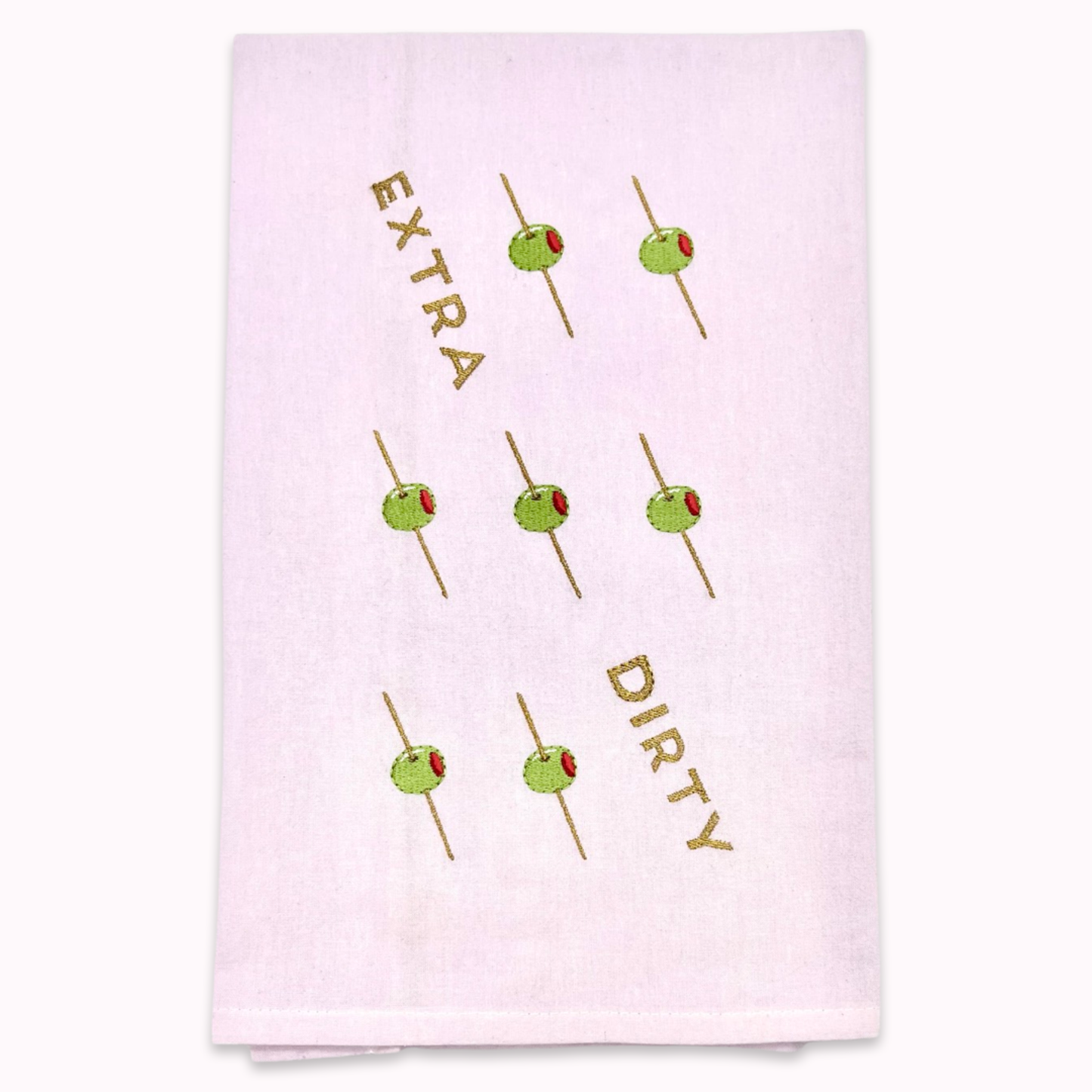 White kitchen towel with olive skewer design and text "extra dirty" on a white background