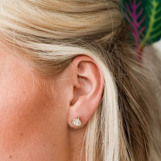 garlic stud earring on ear lobe