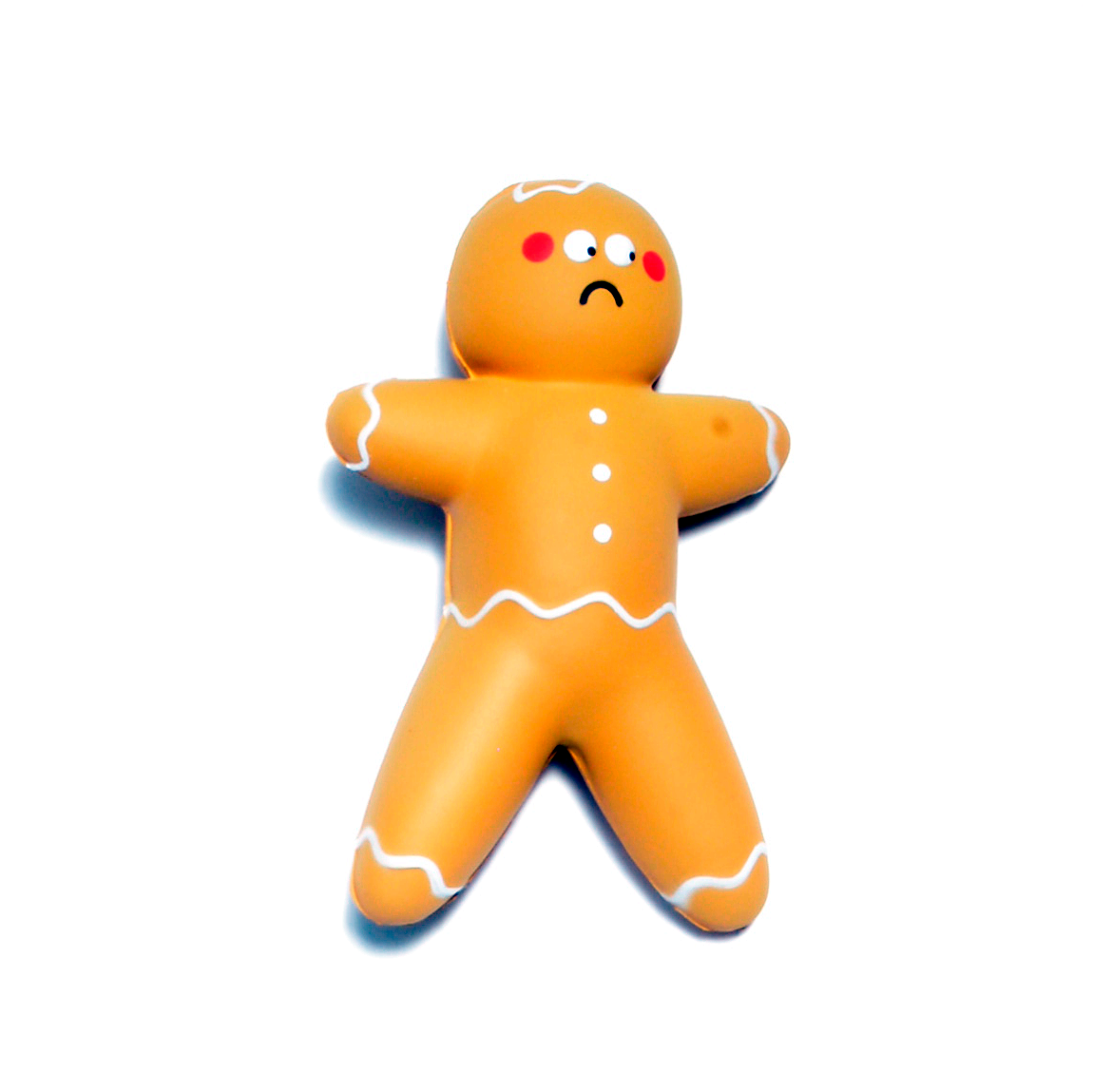 Gingerbread man stress ball with a sad expression on a white background