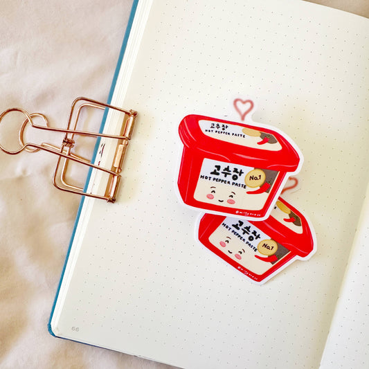 Sticker of a tub of gochujang (Korean spicy pepper paste)