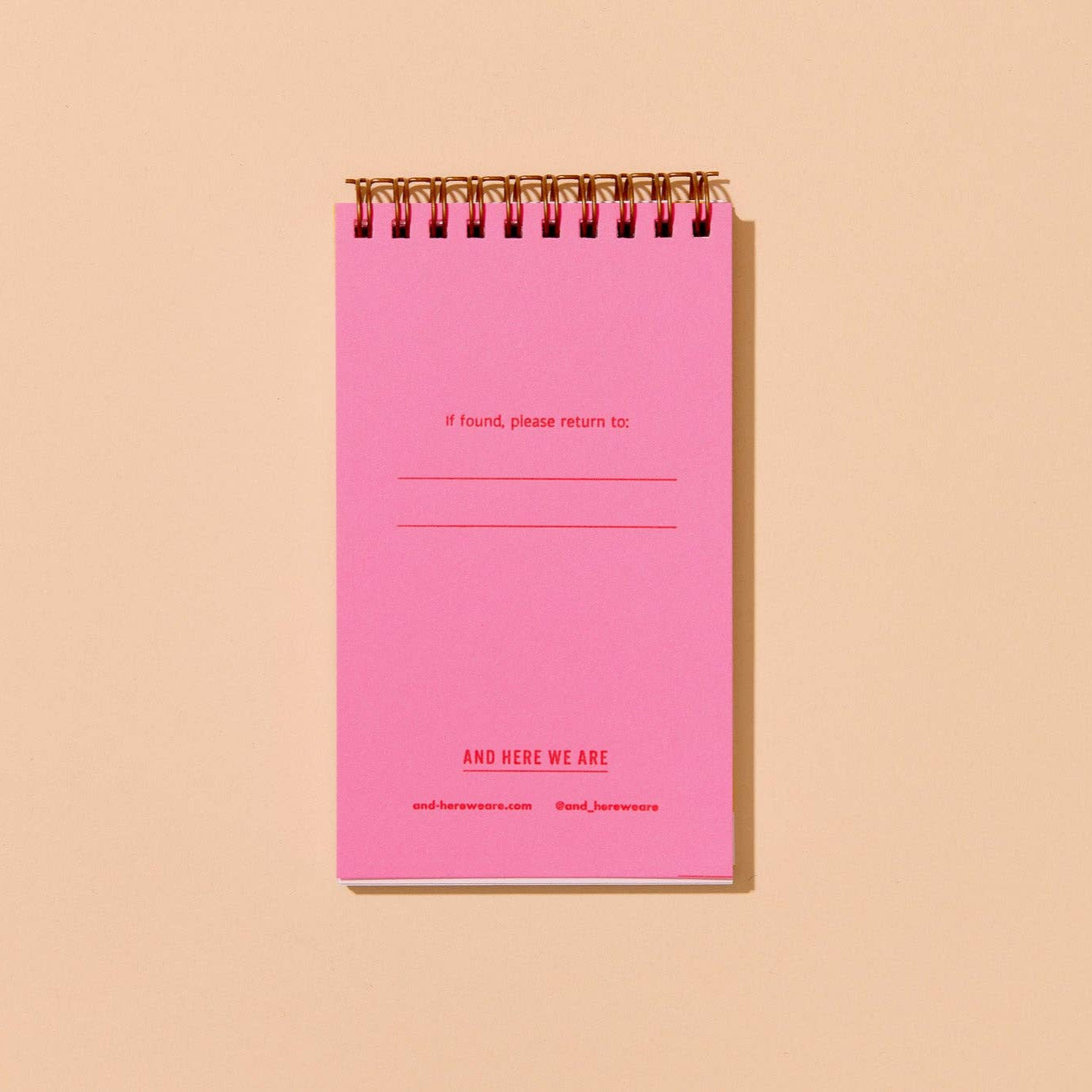 inside flap of goldfish pocket notebook. Has pink background and small red text that reads "If found, please return to:" as well as brand name at bottom
