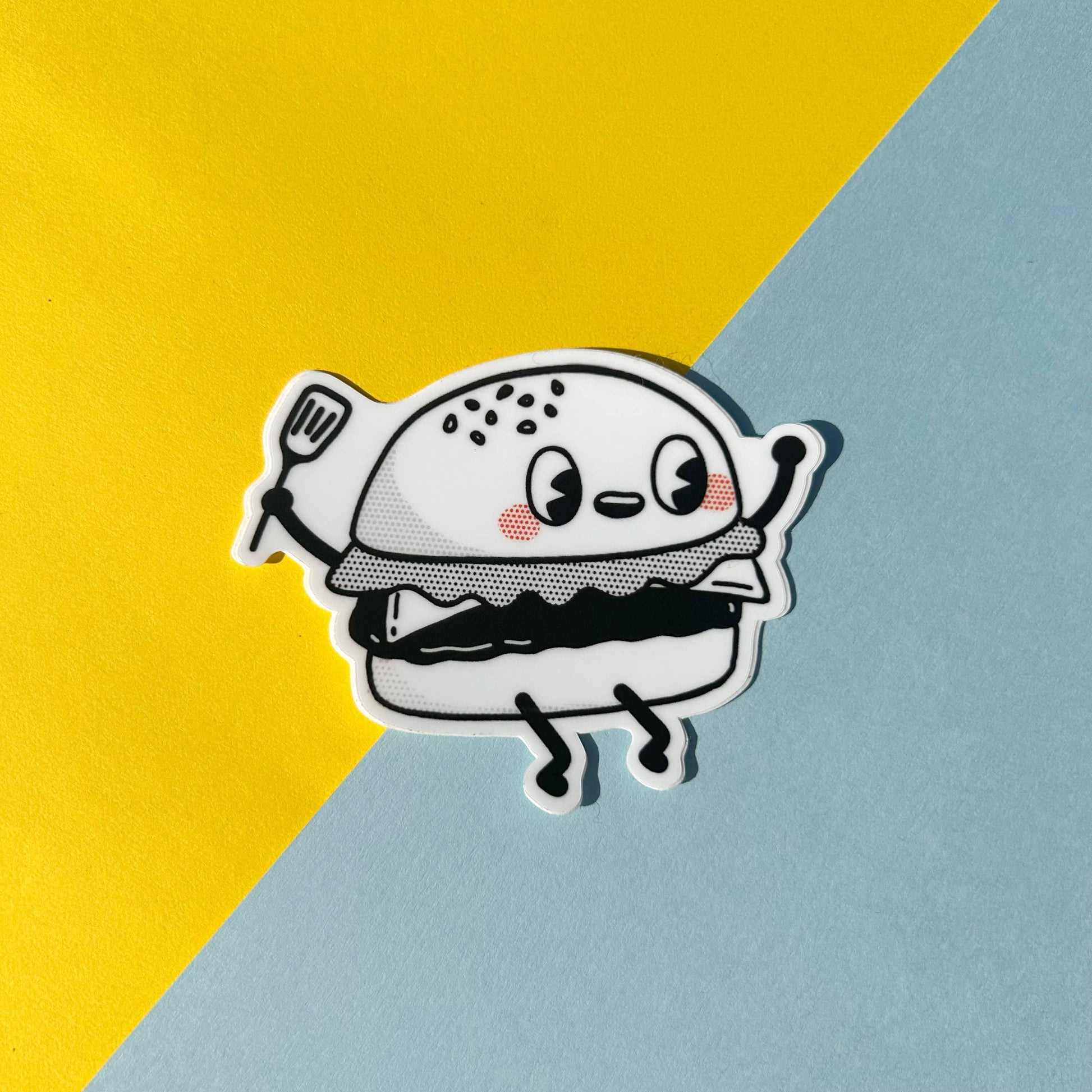 Cartoon hamburger sticker on a yellow and blue background