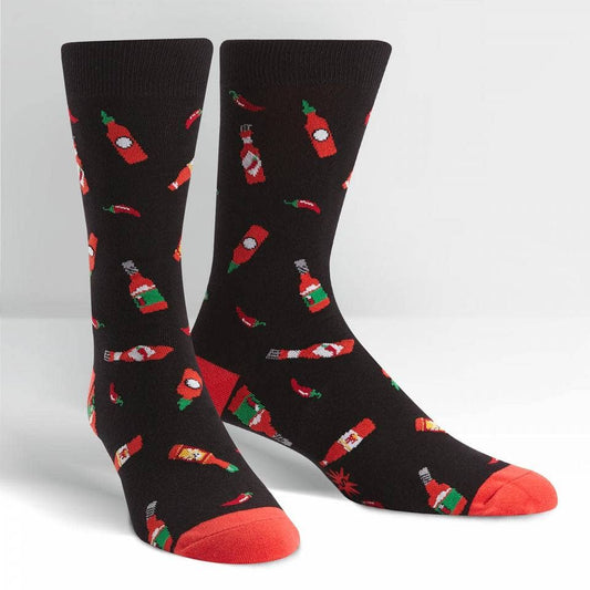 black crew socks with red toe tips. design has bottles of hot sauce and chili peppers all over