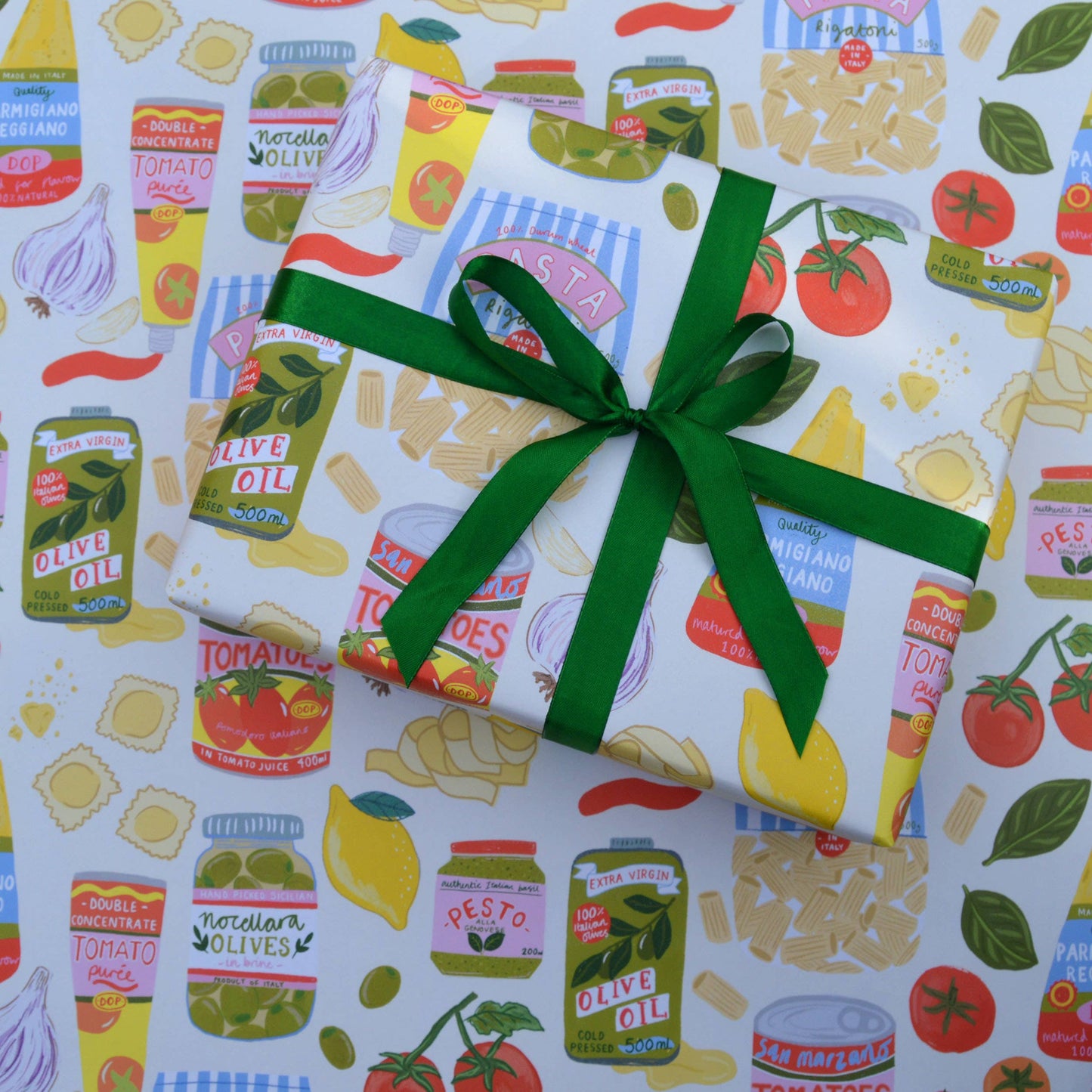 single sheet of gift wrap designed with a variety of popular Italian ingredients including pasta, tomatoes, olives, garlic, pesto, basil, etc.