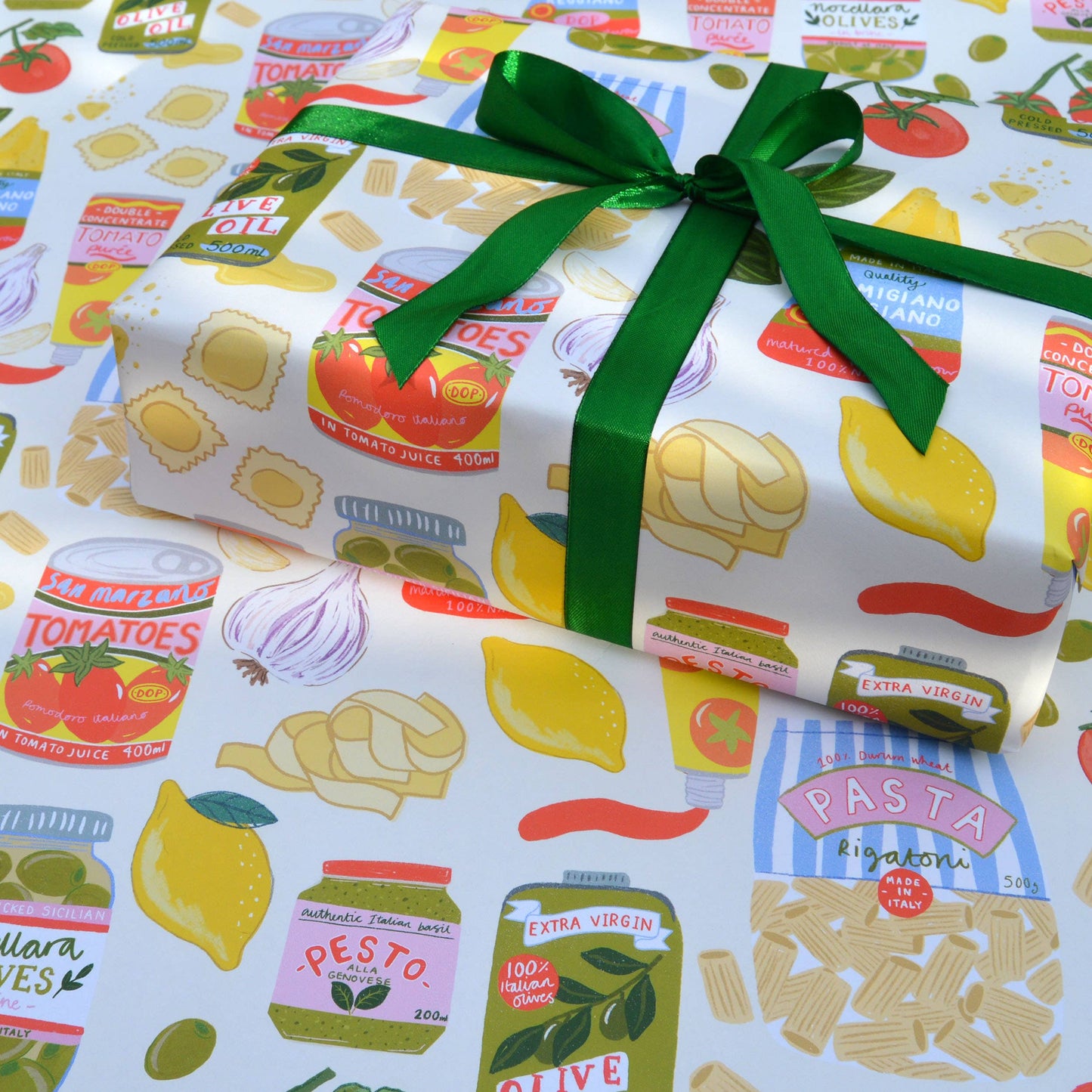 single sheet of gift wrap designed with a variety of popular Italian ingredients including pasta, tomatoes, olives, garlic, pesto, basil, etc.
