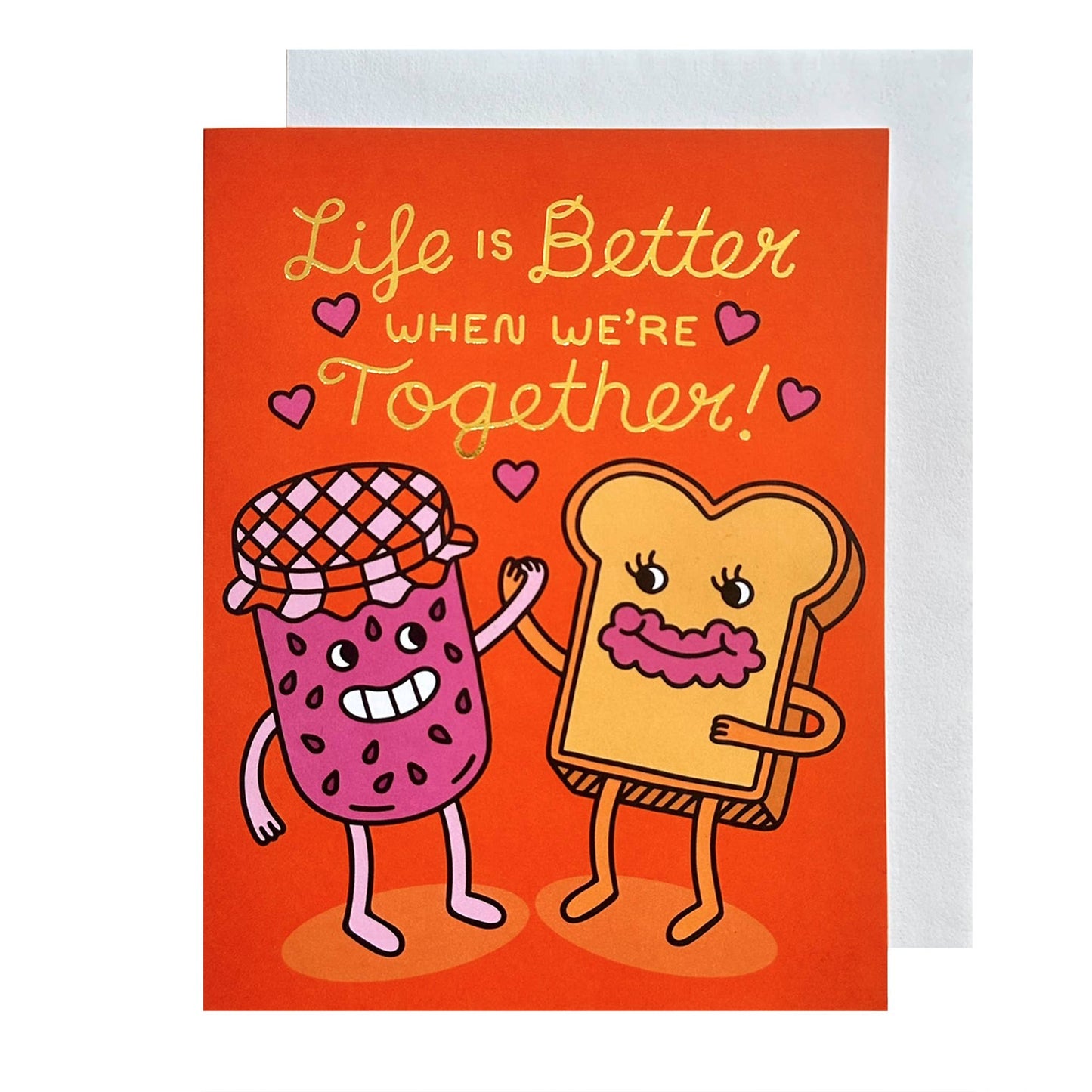 red greeting card with gold foil text that reads "Life is better when we're together" Has an illustration of a jam jar holding hands with a slice of toast