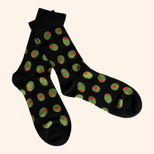 pair of black socks with stuffed green olives on it