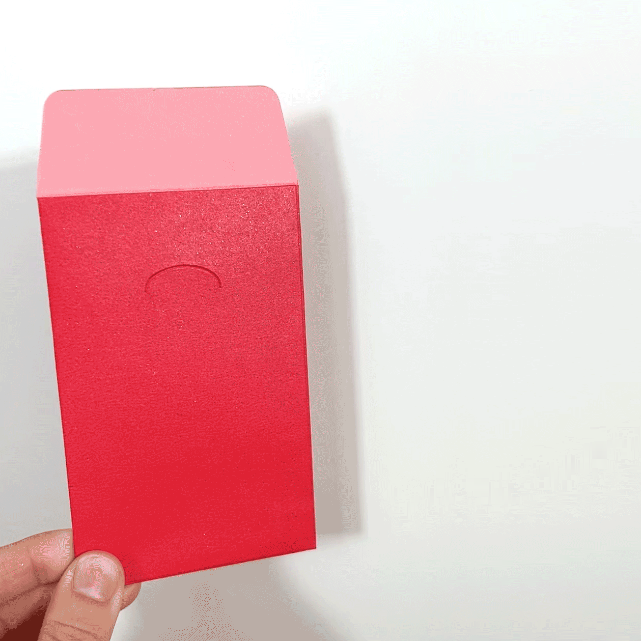 GIF of someone holding the lunar new year red envelope