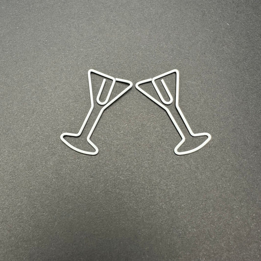 Two white martini paperclips.