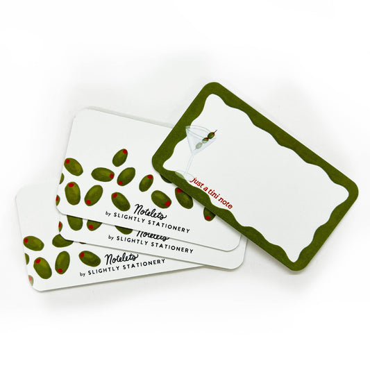Set of stationery items with green and red design on a white background