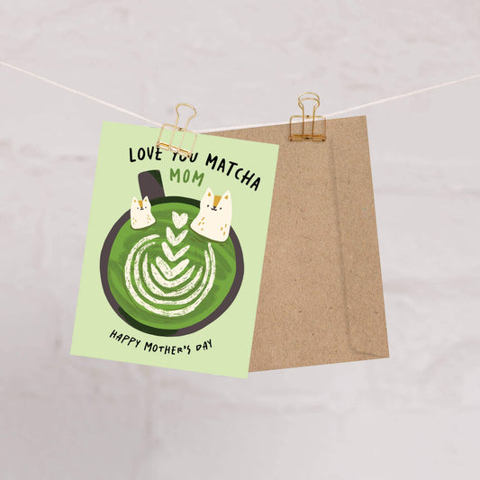 Mother's Day card with a green matcha latte design and text, hanging on a string.