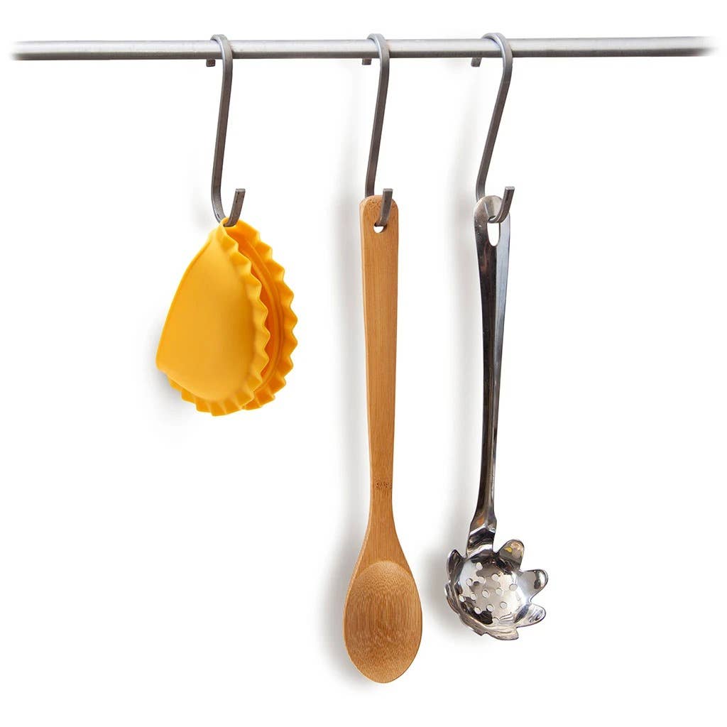 Mezzelune pot holder hanging on s-hook with wooden spoon and pasta spoon