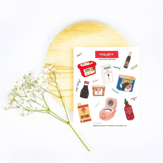 sticker sheet filled with various asian kitchen seasoning essentials -- gochujang, sesame oil, mochiko rice flour, soy sauce, soy bean paste, rice cooker, sriracha, spam, oyster sauce