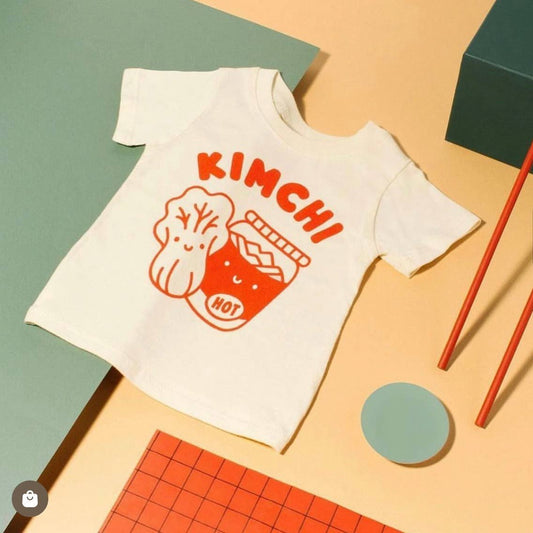 Baby size KImchi Tee -- says Kimchi across the chest with a cabbage next to a pickling jar, all in red ink