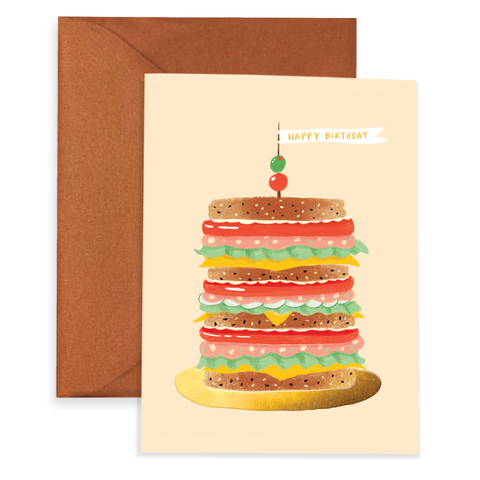 Greeting card with a stacked mortadella sandwich illustration and 'Happy Birthday' text, brown envelope.