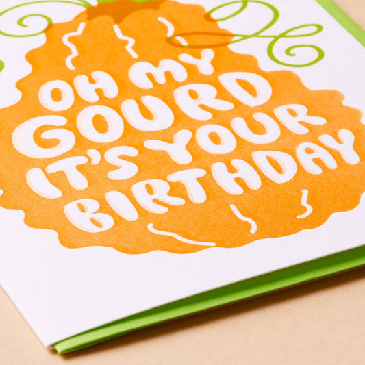 Birthday card with 'Oh my gourd it's your birthday' text on an orange background