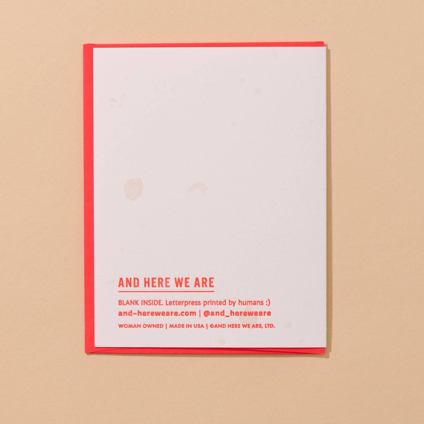 back of stuffed olive card. Blank except for brand info at bottom