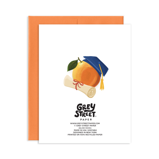 Card with an orange wearing a graduation cap design, featuring Grey Street Paper branding.