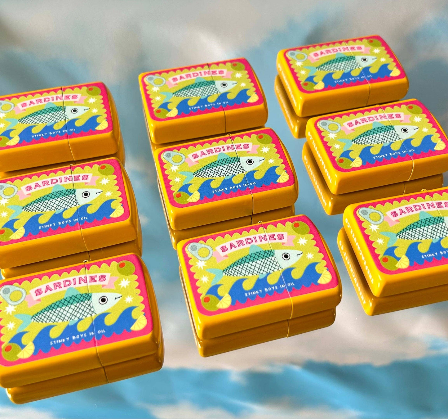 9 sardine refillable lighters lined up in 3 rows of 3