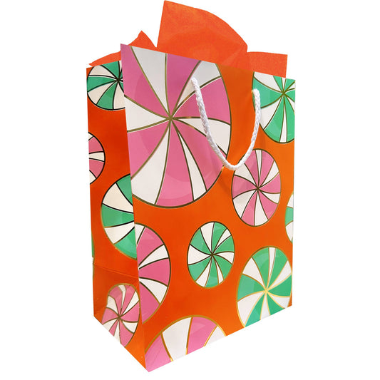 Colorful gift bag with a geometric peppermint pattern on an orange background