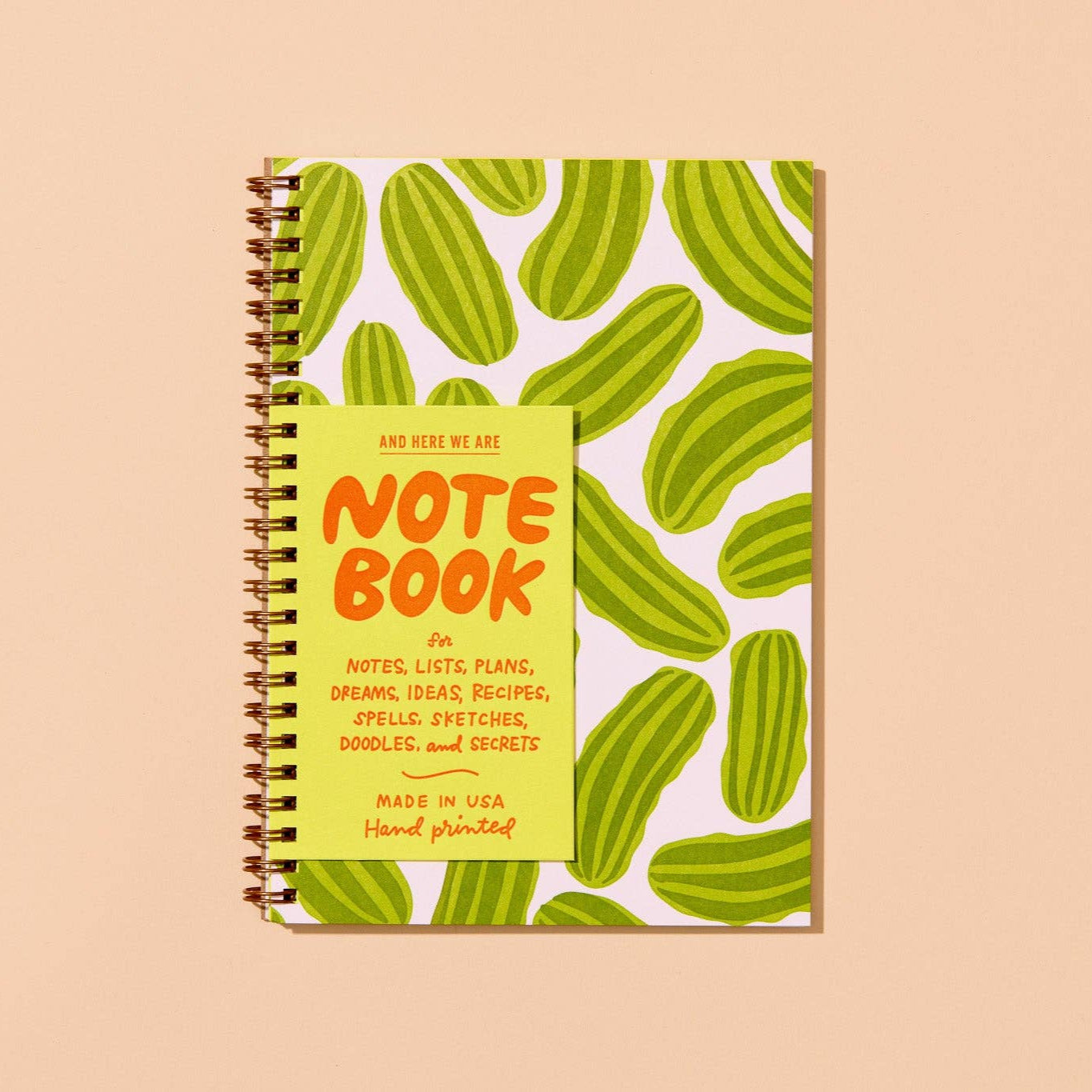 lined notebook which features a pickle design
