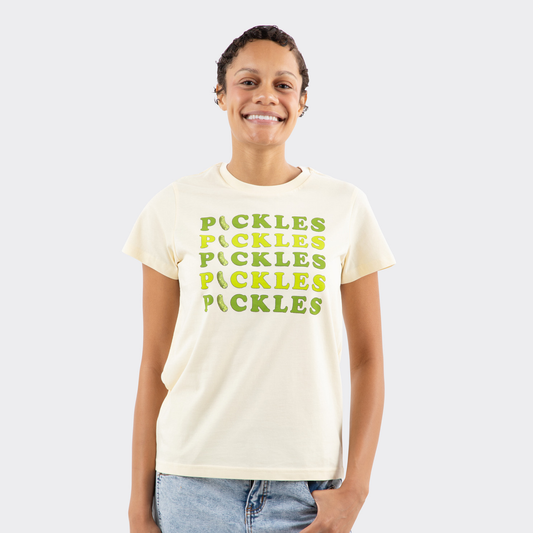 Person wearing a beige t-shirt with 'PICKLES' text in green on a light gray background