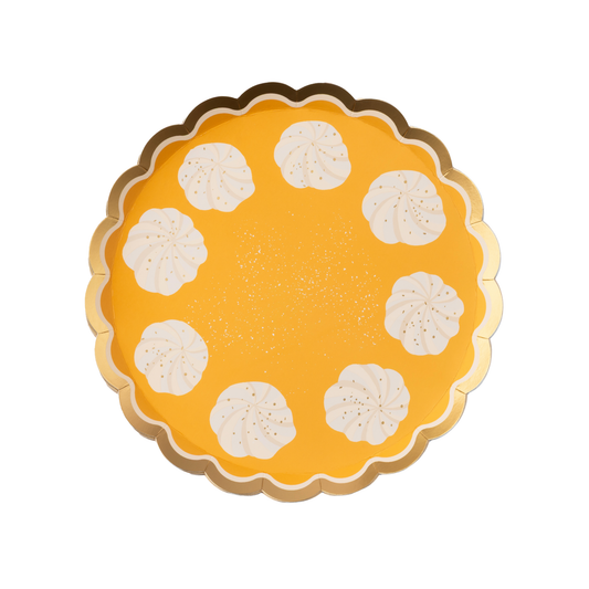Yellow orange paper plate with scalloped edge and white whipped cream design on a white background
