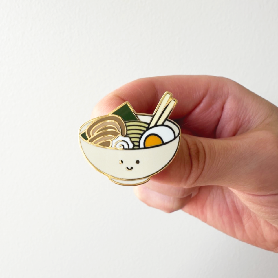 smiley faced ramen bowl enamel pin