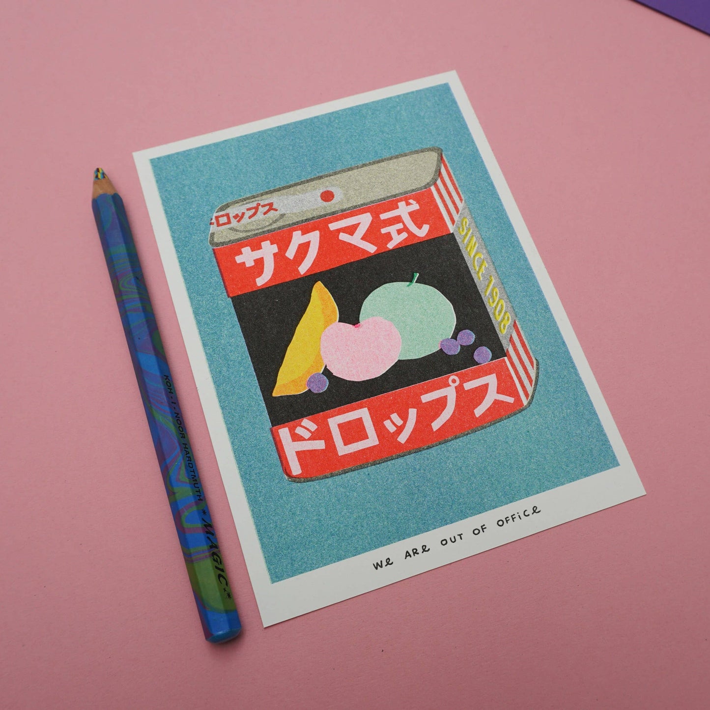 Risograph print illustration of Sakuma Drops with colorful design and pencil on a pink background