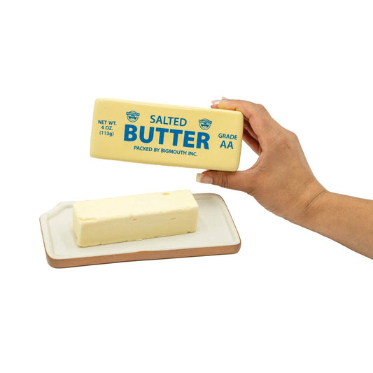 A butter keeper/dish designed to look like an actual stick of salted butter. Pictured here with an actual stick of butter inside, like how it's meant to be used.