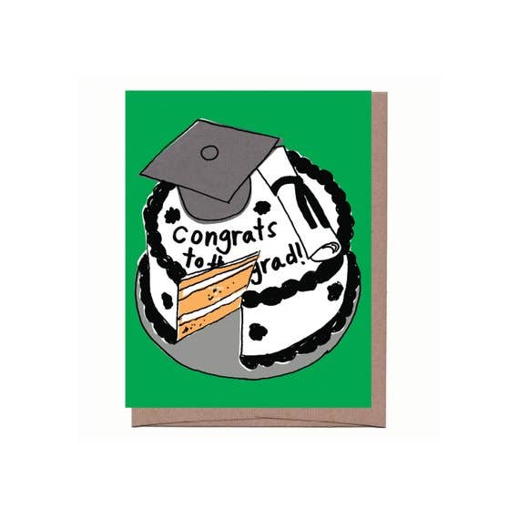 Graduation-themed greeting card with cake illustration and 'Congrats to grad!' text on a green background. scratch and sniff cake scent