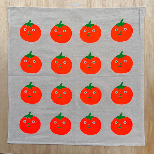 Screenprinted by hand tea towel. Design has 4 rows with 4 tomatoes each, each also with a face on it.
