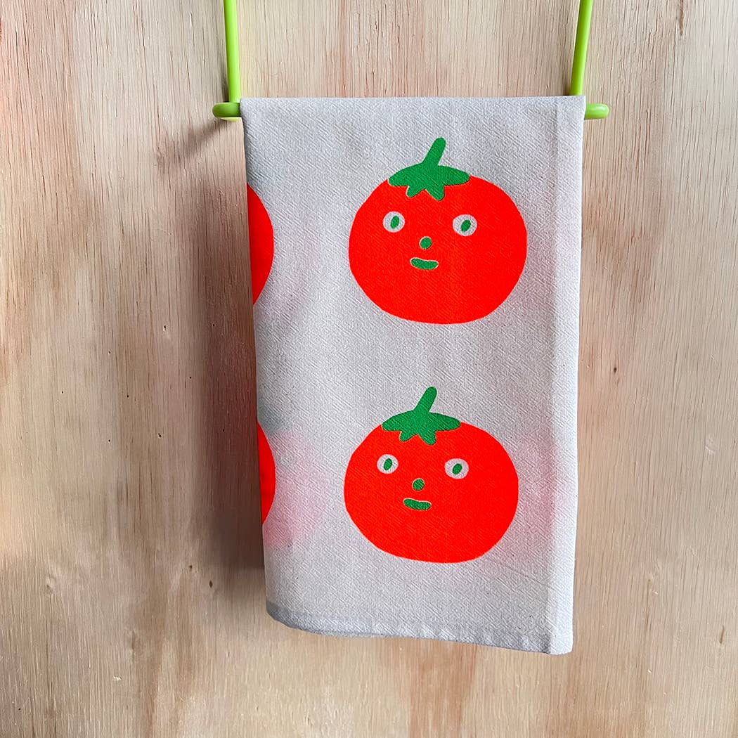 tomato design tea towel, screenprinted by hand on towel rack