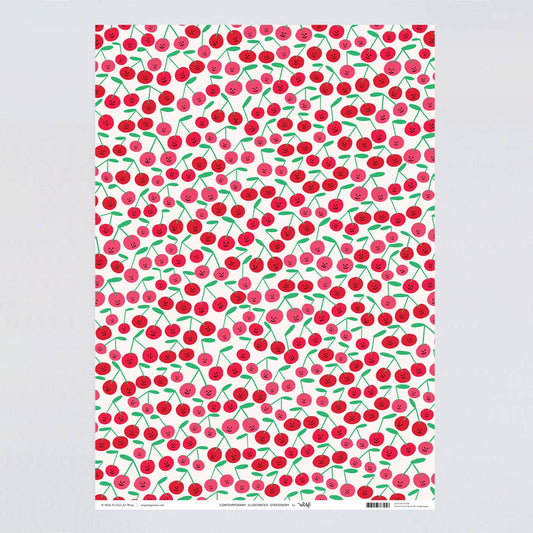 Gift wrap sheet with a smiley-faced cherry design all over