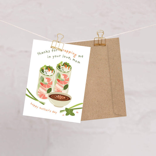 Greeting card with food illustration and brown envelope on a light background