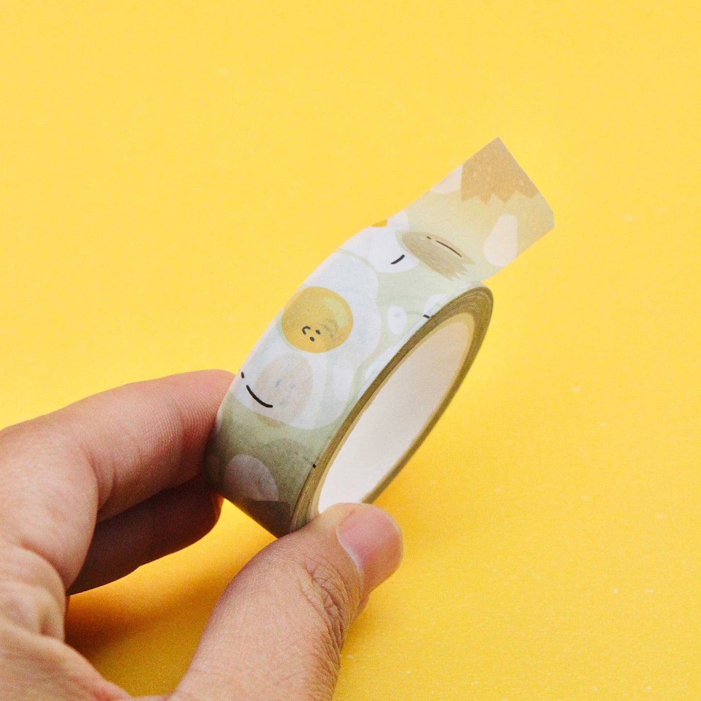Sunny side up washi tape with assorted eggs and cracked egg shells.
