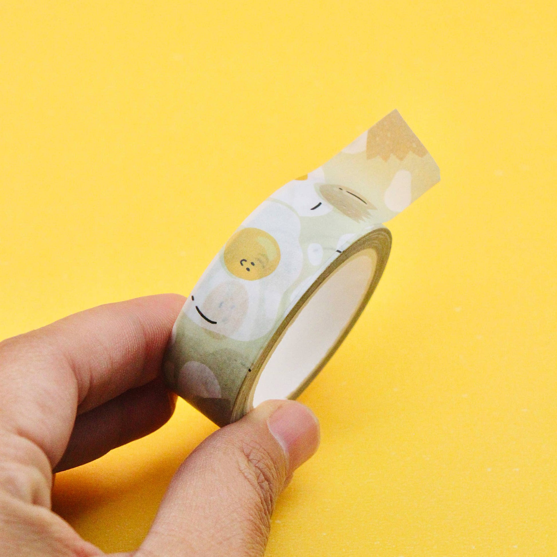 Sunny side up washi tape with assorted eggs and cracked egg shells.