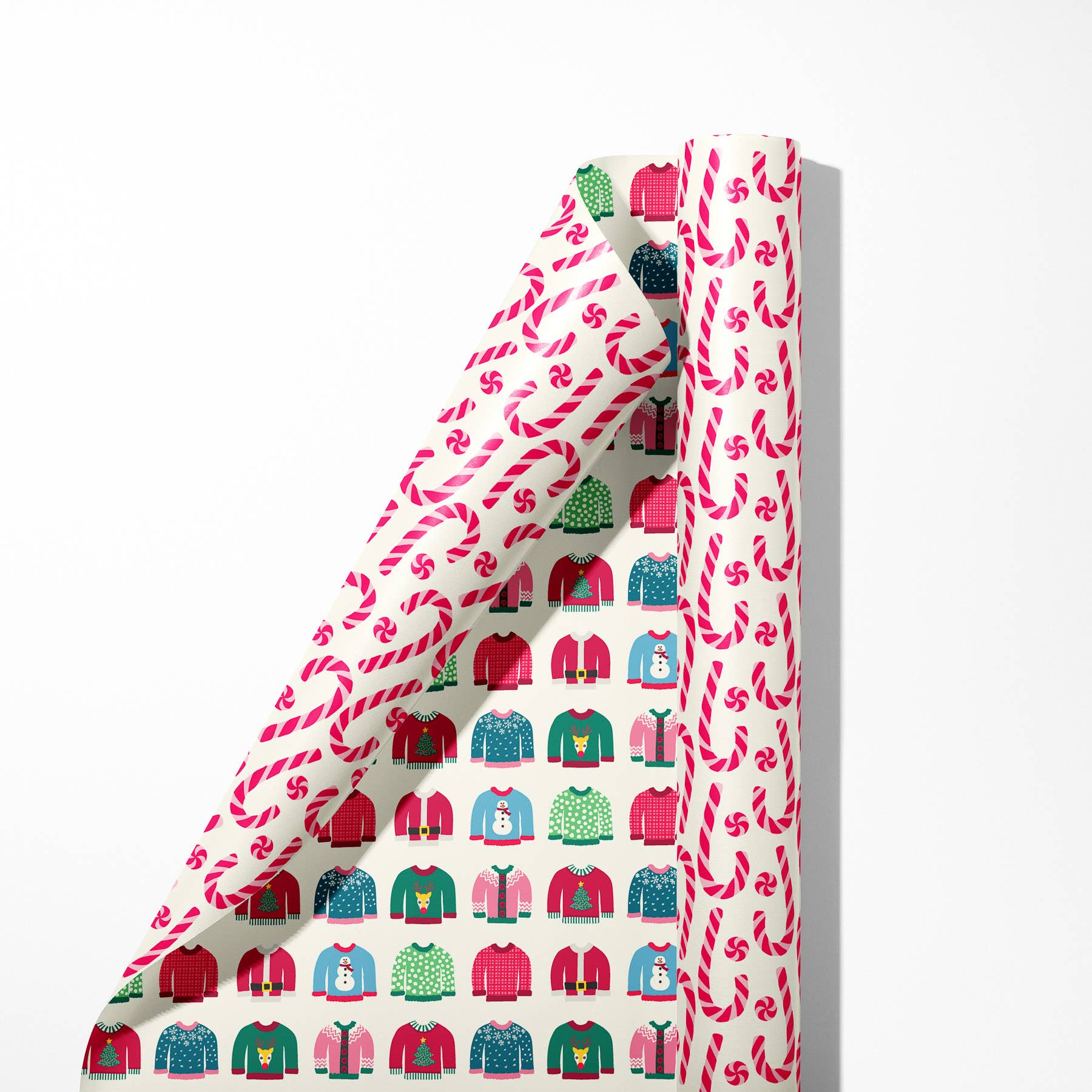 Single sheet of double sided gift wrap -- one side has a peppermint candy/candy cane design and the other has ugly holiday sweaters on them